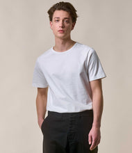 Load image into Gallery viewer, Model wearing Merz B. Schwanen Loop Wheel Tee in White.