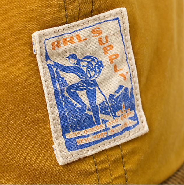 RRL- Oil Cloth/Cotton Corduroy "RRL Supply" Logo Sportsman Hat - close up on logo