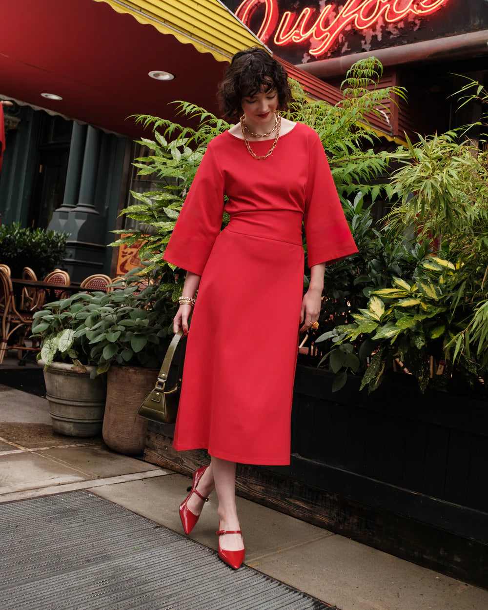 Model wearing Frances Valentine - Whitney Wrap Dress in Red.