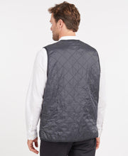 Load image into Gallery viewer, Model wearing Barbour Polarquilt Waistcoat Zip-In Liner in Navy - back.