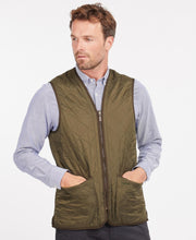 Load image into Gallery viewer, Model wearing Barbour Polarquilt Waistcoat Zip-In Liner in Olive.