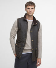 Load image into Gallery viewer, Model wearing Barbour Westmorland Wax Jacket in Olive.