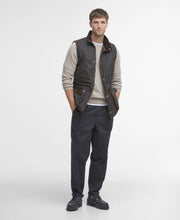 Load image into Gallery viewer, Model wearing Barbour Westmorland Wax Jacket in Olive.