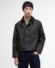 Load image into Gallery viewer, Model wearing Barbour Spey Wax Jacket in Olive.