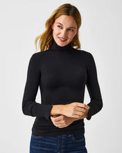 Load image into Gallery viewer, Model wearing Spanx - Long Sleeve Turtleneck in Black.