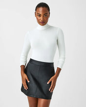 Load image into Gallery viewer, Model wearing Spanx - Long Sleeve Turtleneck in Powder.