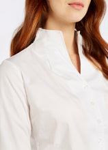 Load image into Gallery viewer, Model wearing Dubarry Snowdrop long sleeve button down shirt in white.