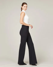 Load image into Gallery viewer, Model wearing Spanx - The Perfect Pant, Hi-Rise Flare in Classic Black 20252R.