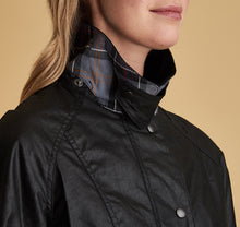 Load image into Gallery viewer, Model wearing Barbour Beadnell wax jacket in black.