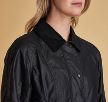 Load image into Gallery viewer, Model wearing Barbour Beadnell wax jacket in navy.