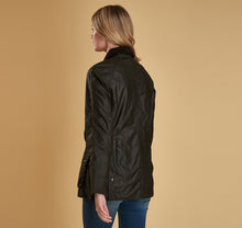 Load image into Gallery viewer, Model wearing Barbour Beadnell wax jacket in olive.