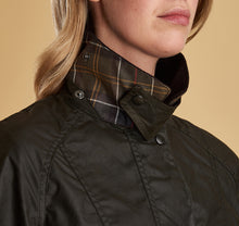 Load image into Gallery viewer, Model wearing Barbour Beadnell wax jacket in olive.