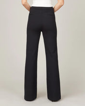 Load image into Gallery viewer, Model wearing Spanx - The Perfect Pant, Hi-Rise Flare in Classic Black 20252R - back.
