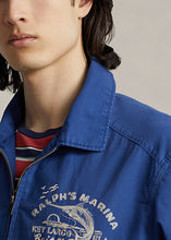 Load image into Gallery viewer, Model wearing POLO Ralph Lauren - Ralph's Marina Poplin Jacket in Vineyard Royal.