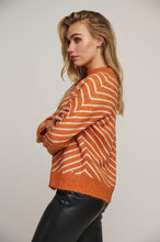 Load image into Gallery viewer, Model wearing Rino &amp; Pelle - Annelie Mock Neck Sweater in Clay Birch.
