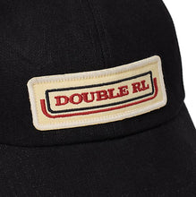 Load image into Gallery viewer, RRL- Cotton 3x1 RHT Denim &quot;Double RL&quot; Logo Trucker Hat w/ Mesh Back Panels - close up on logo
