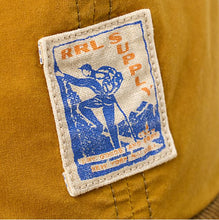 Load image into Gallery viewer, RRL- Oil Cloth/Cotton Corduroy &quot;RRL Supply&quot; Logo Sportsman Hat - close up on logo
