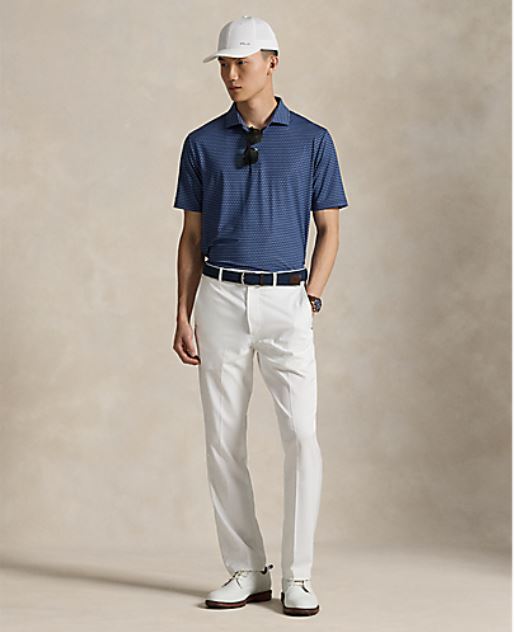 model wearing RLX- SS Lightweight Airflow Printed Polo - Navy Golf Buggy