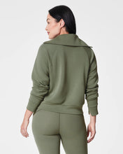 Load image into Gallery viewer, Model wearing Spanx - Air Essentials Half Zip in Clover - back.
