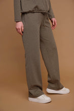 Load image into Gallery viewer, Model wearing Rino &amp; Pelle - Bindina Wide Leg Trousers in Stone Graphics.
