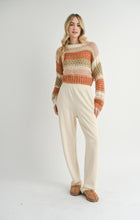 Load image into Gallery viewer, Model wearing Sadie &amp; Sage - Butter Pecan Chunky Sweater Brick Multi.
