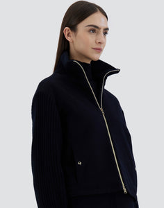 Model wearing Herno Women's Bomber Jacket in Cashmere in Dark blue.