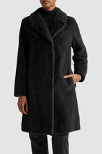 Load image into Gallery viewer, Model wearing Herno Women&#39;s Soft Faux Fur Long Coat in Black.
