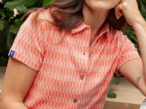 Model wearing Criquet - Women's Terrycloth Button Up in Check Jacquard - Coral.