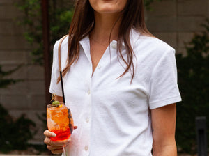 Model wearing Criquet - Women's Terrycloth Button Up in White.