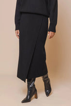 Load image into Gallery viewer, Model wearing Rino &amp; Pelle - Janou Midi Skirt in Black.
