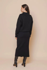 Model wearing Rino & Pelle - Janou Midi Skirt in Black - back.