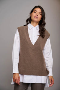 Model wearing Rino & Pelle - V-Neck Sweater Vest in Taupe.