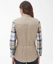 Load image into Gallery viewer, Model wearing Barbour Cavalry Gilet in Light Fawn - back.
