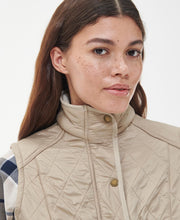 Load image into Gallery viewer, Model wearing Barbour Cavalry Gilet in Light Fawn.

