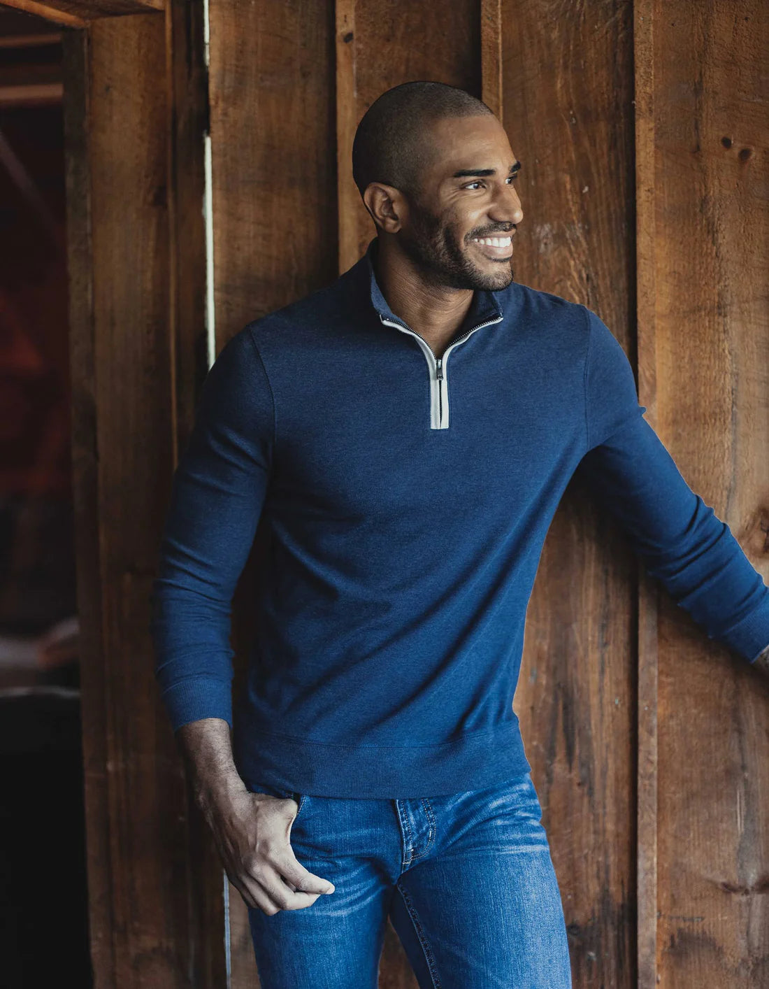 Model wearing The Normal Brand - Puremeso Weekend Quarter Zip in Indigo Blue.