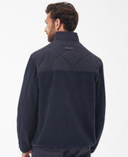 Load image into Gallery viewer, Model wearing Barbour Hybrid Fleece Jacket in Navy - back.
