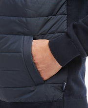 Load image into Gallery viewer, Model wearing Barbour Essential Carn Baffle Zip Thru in Navy.
