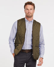 Load image into Gallery viewer, Model wearing Barbour Polarquilt Waistcoat Zip-In Liner in Olive.
