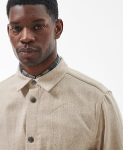 Model wearing Barbour Waterhill Overshirt in Stone Marl.