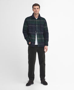 Model wearing Barbour Chapter Tailored Check Overshirt in Green Loch Tartan.