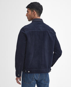 Model wearing Barbour Garment Dyed Cord Overshirt in Navy - back.