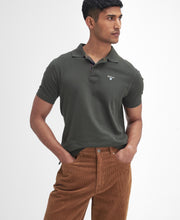 Load image into Gallery viewer, Model wearing Barbour Stretch Cord Trouser in Dark Honey.
