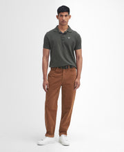 Load image into Gallery viewer, Model wearing Barbour Stretch Cord Trouser in Dark Honey.
