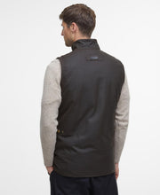 Load image into Gallery viewer, Model wearing Barbour Westmorland Wax Jacket in Olive - back.
