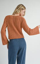 Load image into Gallery viewer, Model wearing Sadie &amp; Sage Perfect Flow Pointelle Knit Sweater in Pumpkin - back.
