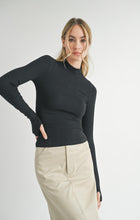 Load image into Gallery viewer, Model wearing Sadie &amp; Sage Ronan Mock Neck Knit Top in Dark Black.
