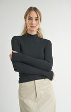 Load image into Gallery viewer, Model wearing Sadie &amp; Sage Ronan Mock Neck Knit Top in Dark Black.
