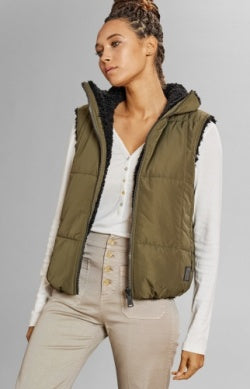 Model wearing Alp N Rock - Sonja Reversible Short Vest in Dark Moss.