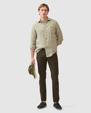 Load image into Gallery viewer, Model wearing Rodd &amp; Gunn - Motion 2 Straight Jean RL Seaweed.
