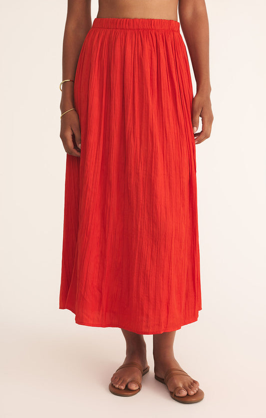 Model wearing ZSupply - Nicoline Crinkle Midi Skirt in Cabana Red.